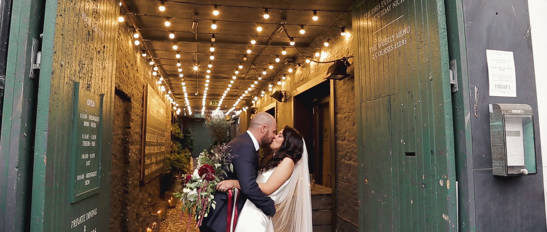 Forgan's St Andrews Wedding Videographer Wedding couple kissing at the netrance to the Forgan's St Andrews.